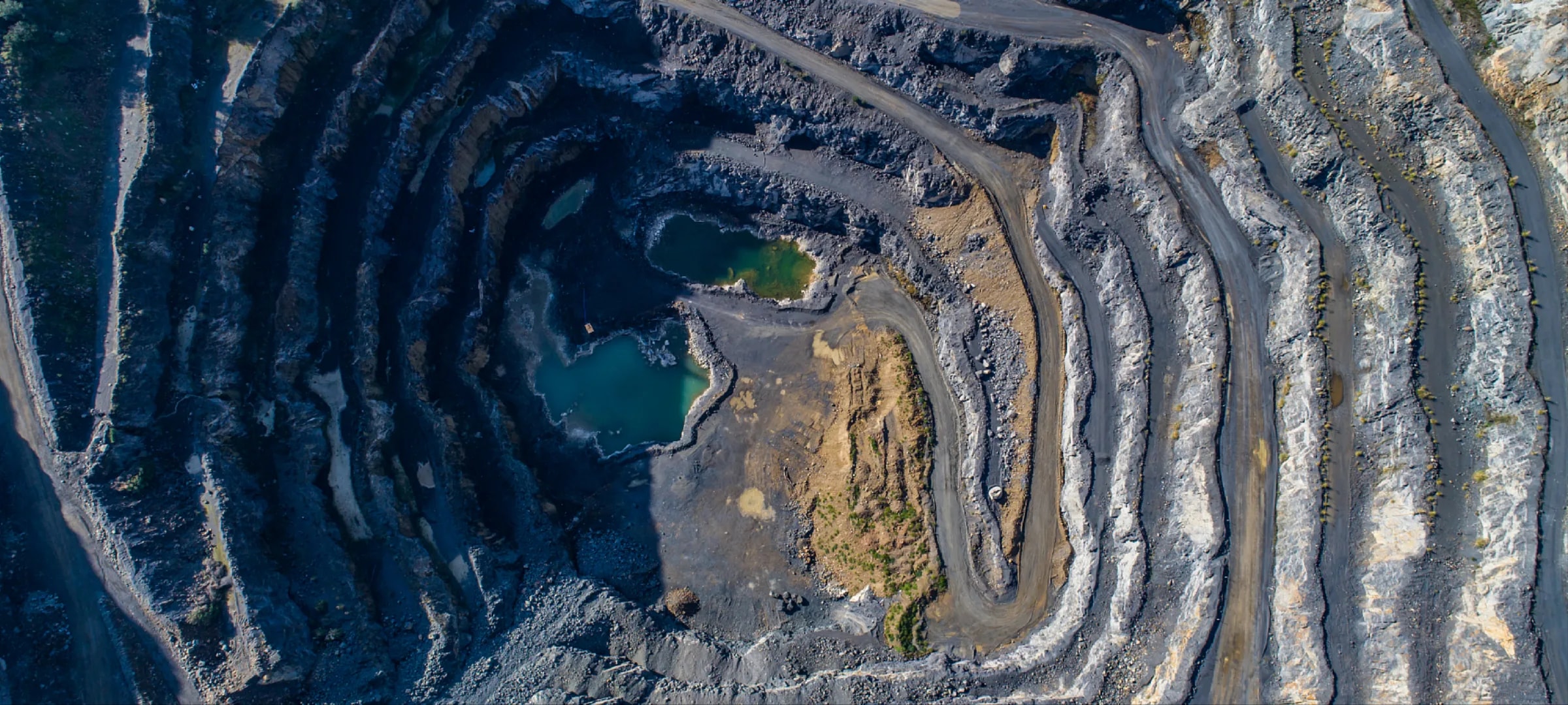 Aerial view of a terraced open-pit mine