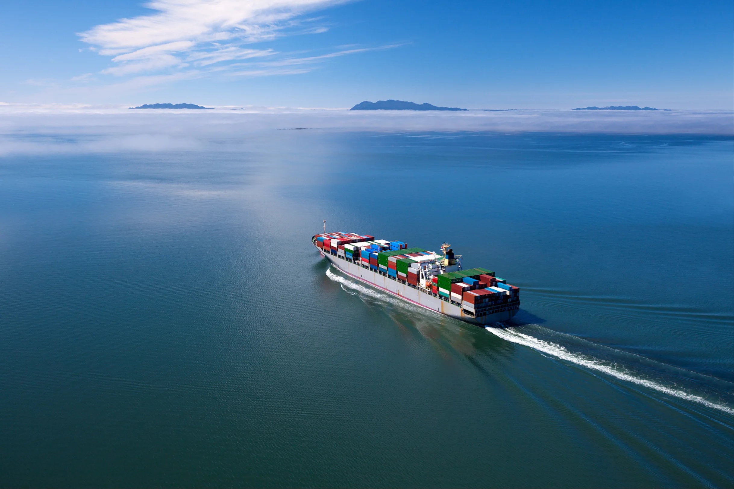 Cargo ship travelling across open water