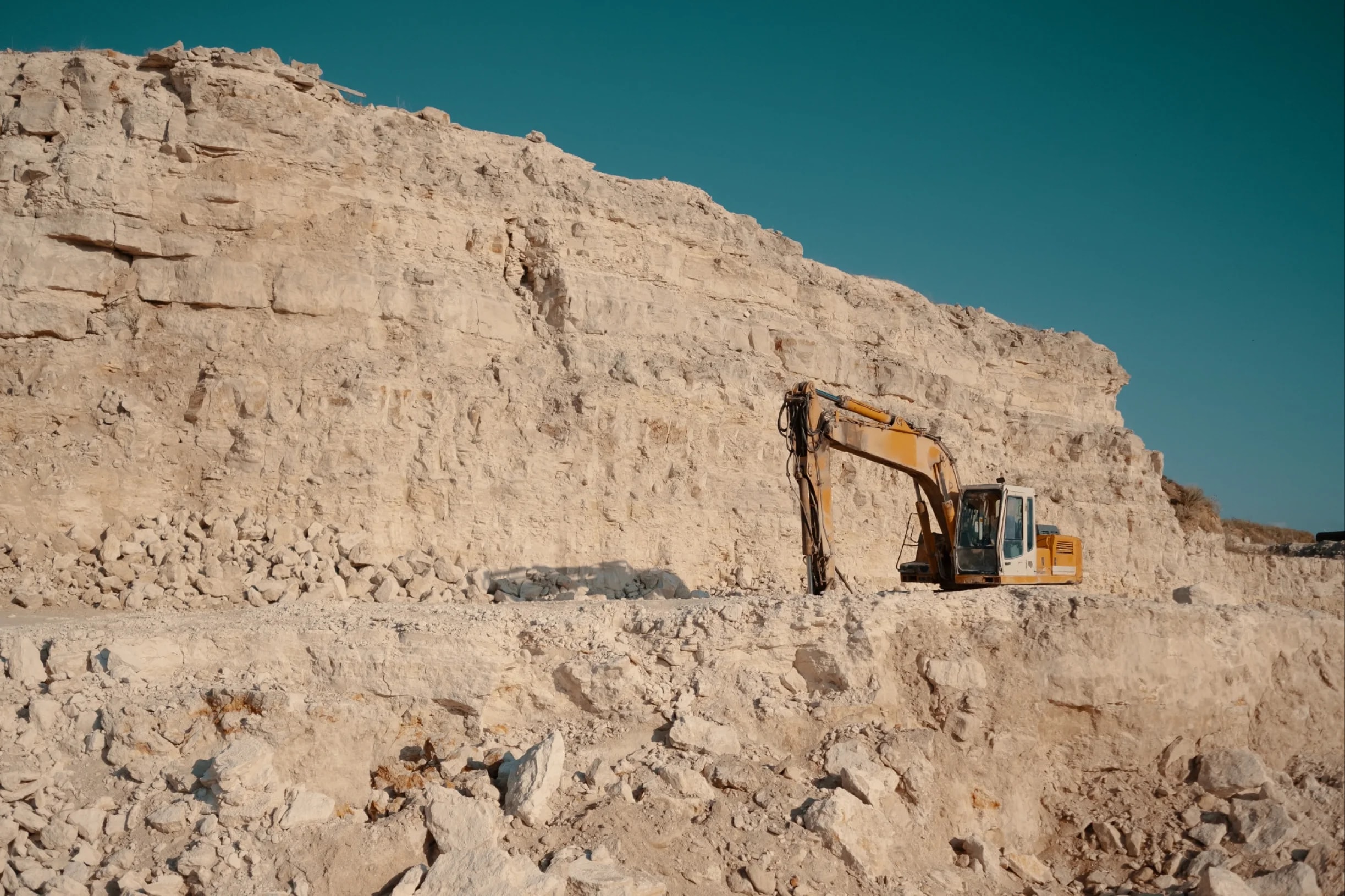 Excavator operating in a quarry